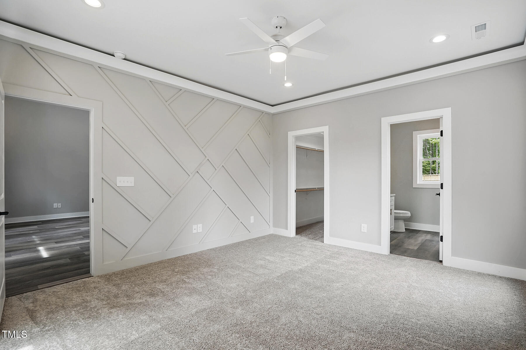 2921 Wall Store Road Garner, NC 27529 - Photo 17 of 25 en empty room with closet and a ceiling fan