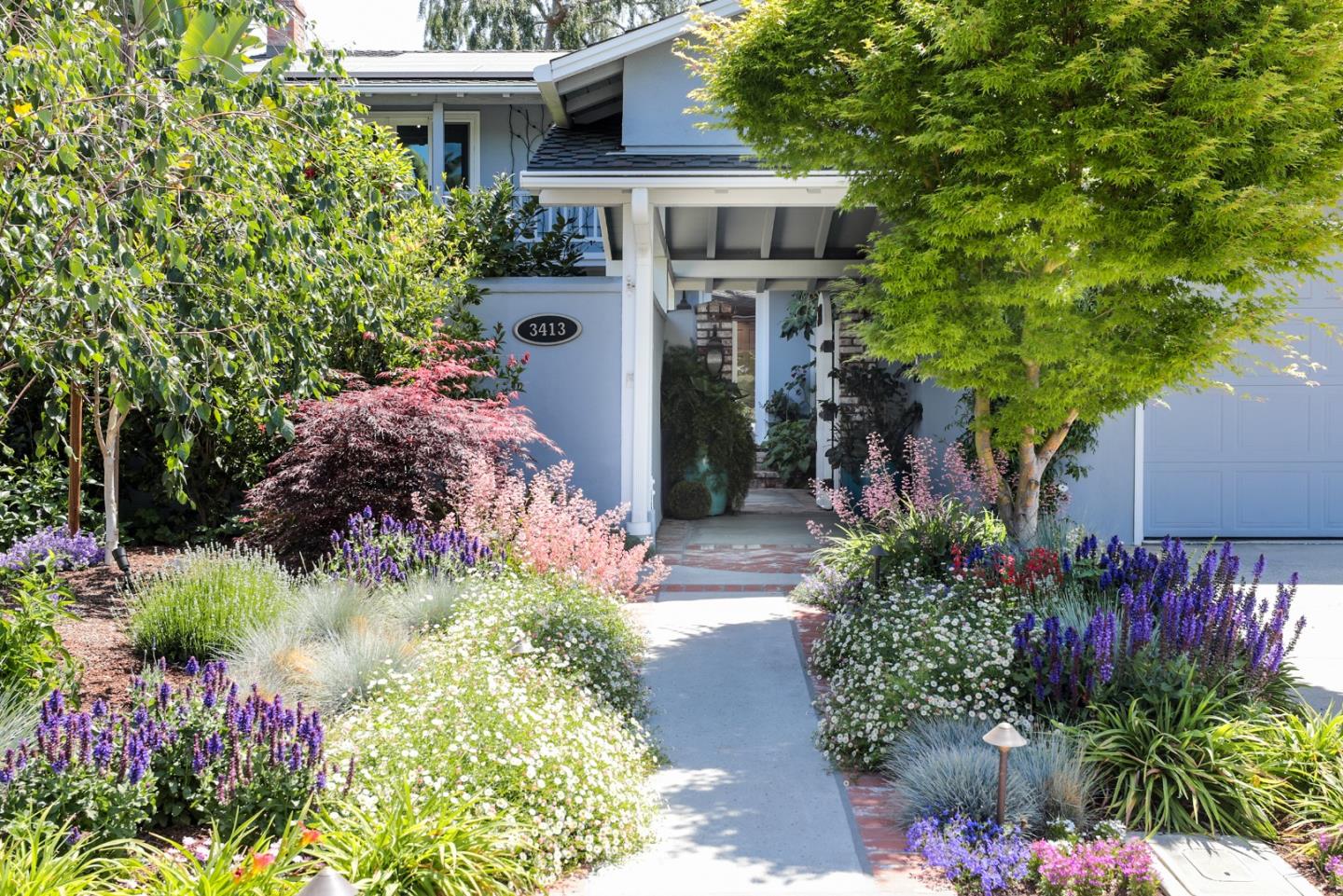 3413 Ridgemont Drive Mountain View, CA 94040 - Photo 2 of 8 a front view of a house with a yard and potted plants
