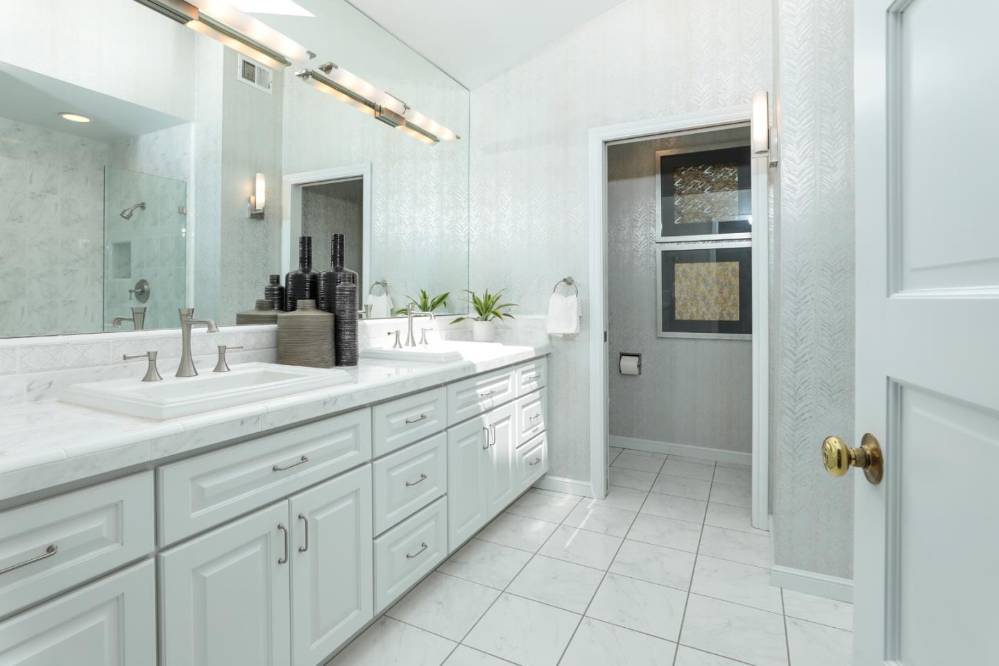 3413 Ridgemont Drive Mountain View, CA 94040 - Photo 5 of 8 a spacious bathroom with a granite countertop sink a mirror a vanity and a shower