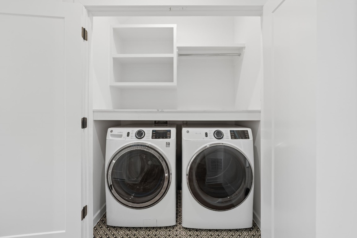 4754 Martin Hill Street Houston, TX 77018 - Photo 8 of 48 First floor laundry area with a quartz counter top and storage space