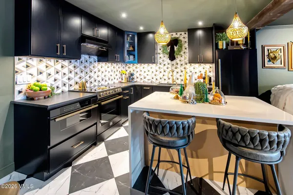 a kitchen with stainless steel appliances kitchen island granite countertop furniture and a kitchen view