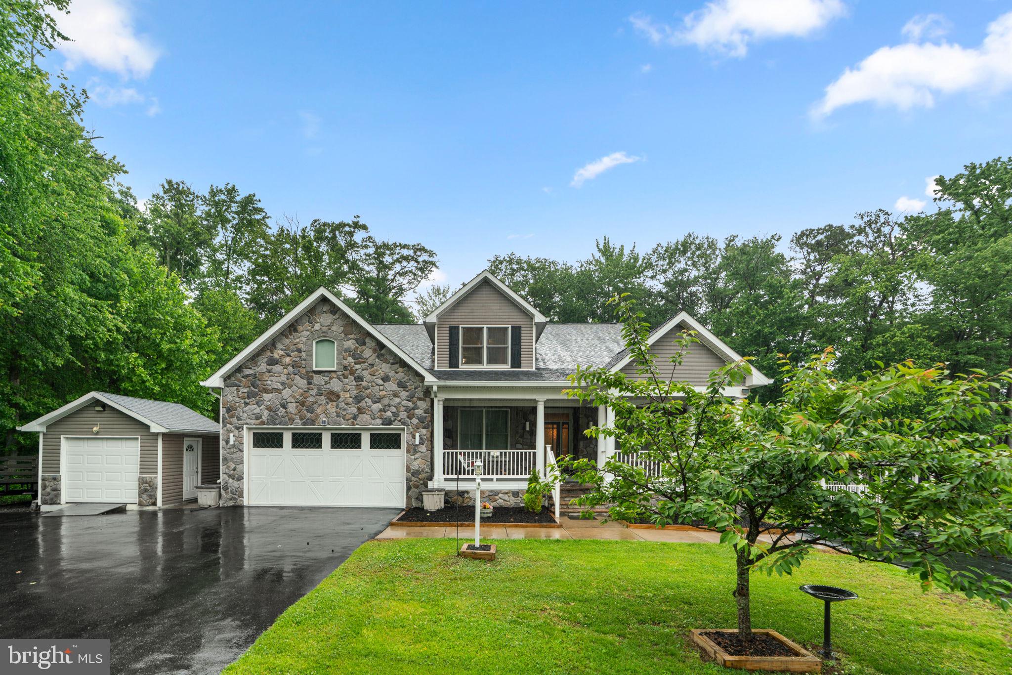 8024 Solley Road Glen Burnie, MD 21060 - Photo 5 of 83 a front view of a house with a garden