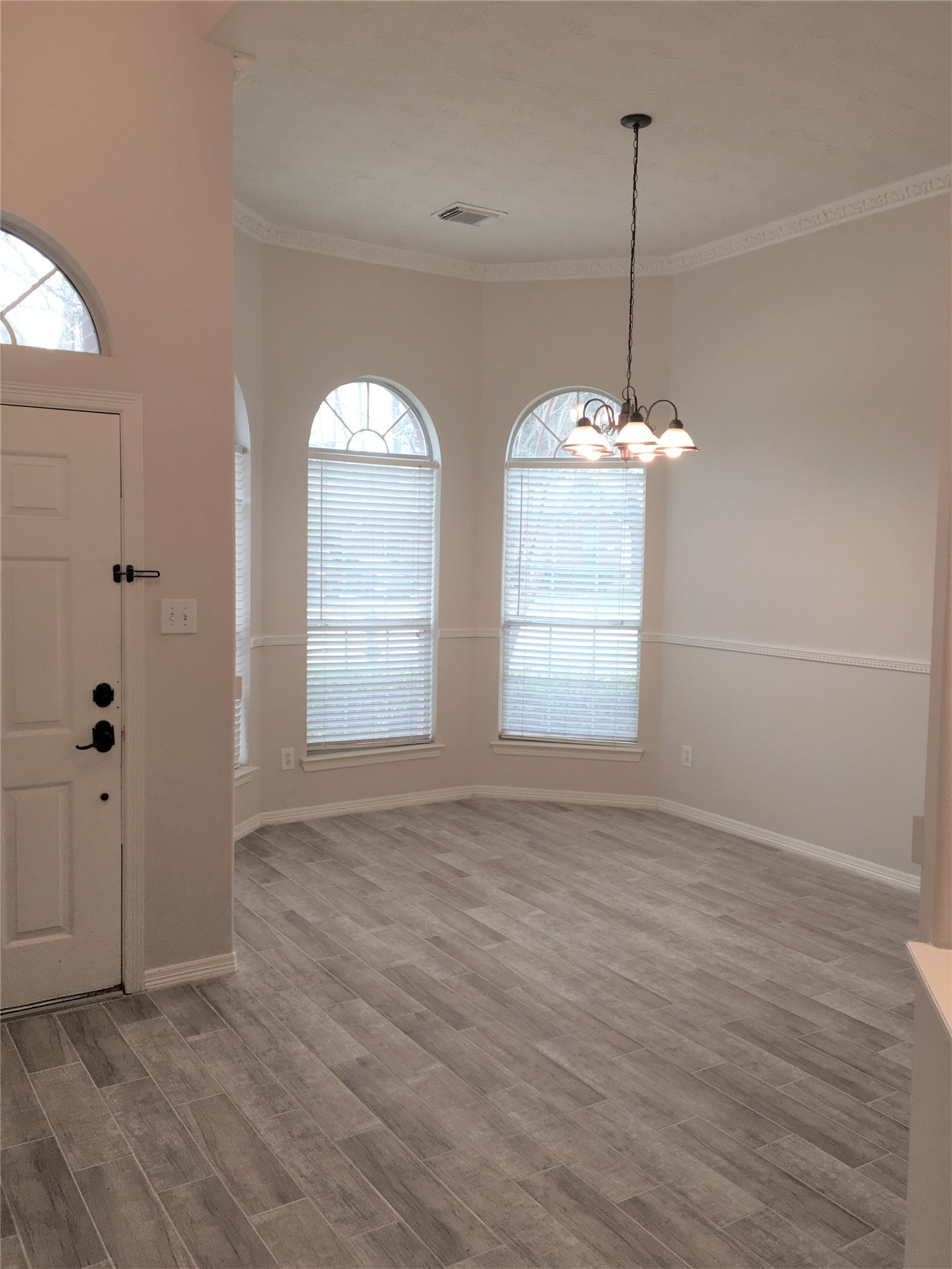 2214 Valley View Crossing Conroe, TX 77304 - Photo 9 of 23 a view of empty room with wooden floor and window