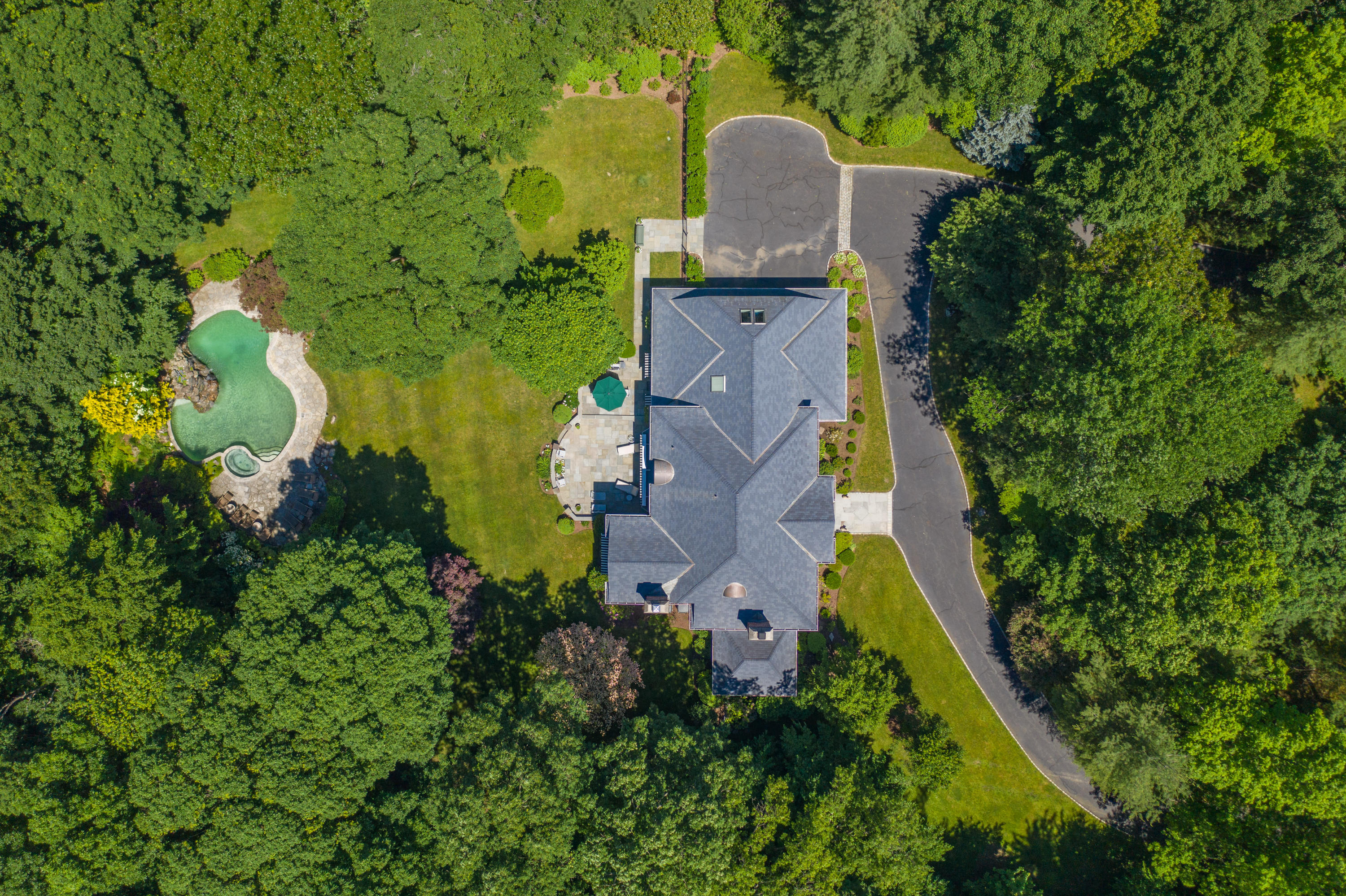 731 Hollow Tree Ridge Road Darien, CT 06820 - Photo 2 of 43 an aerial view of residential house with outdoor space and trees all around