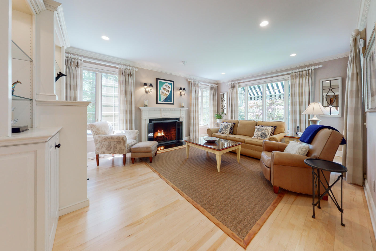 731 Hollow Tree Ridge Road Darien, CT 06820 - Photo 14 of 43 a living room with furniture and a fireplace
