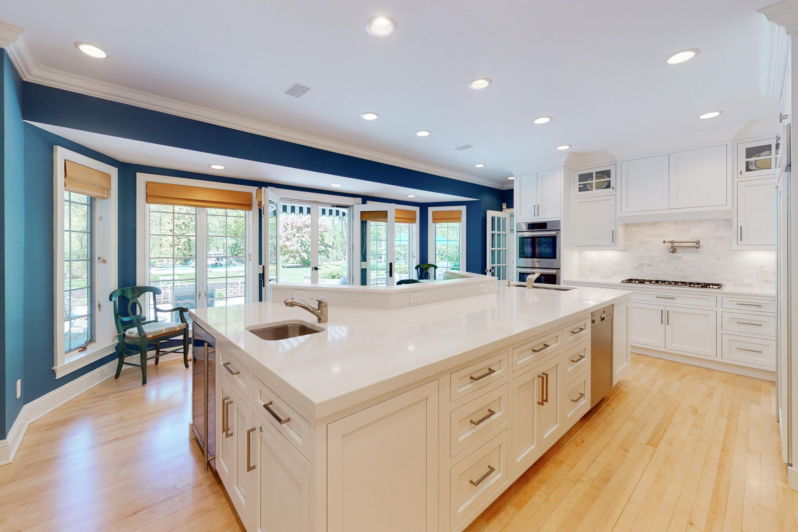 731 Hollow Tree Ridge Road Darien, CT 06820 - Photo 18 of 43 a kitchen with kitchen island and windows