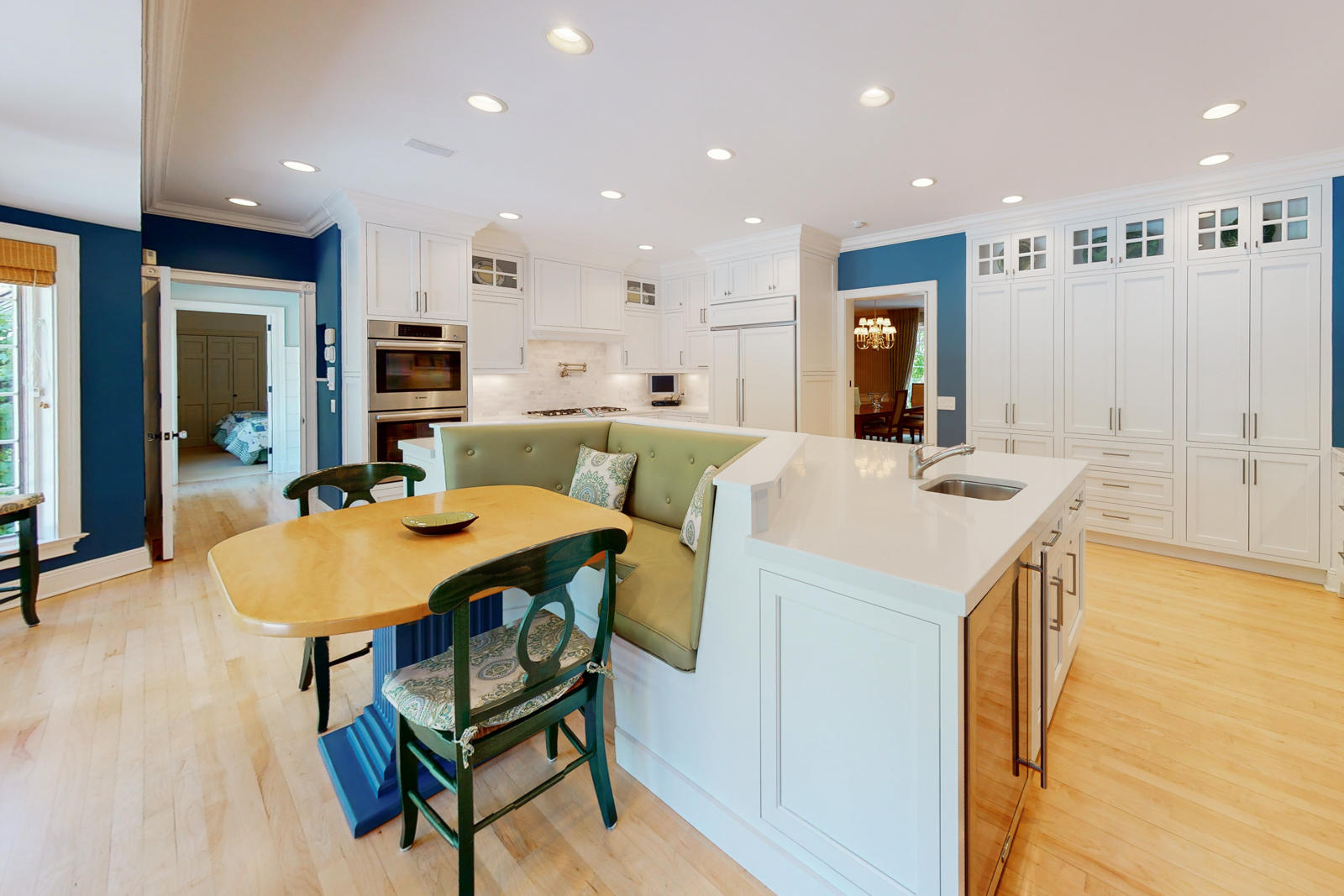 731 Hollow Tree Ridge Road Darien, CT 06820 - Photo 19 of 43 a kitchen with kitchen island a sink table and chairs