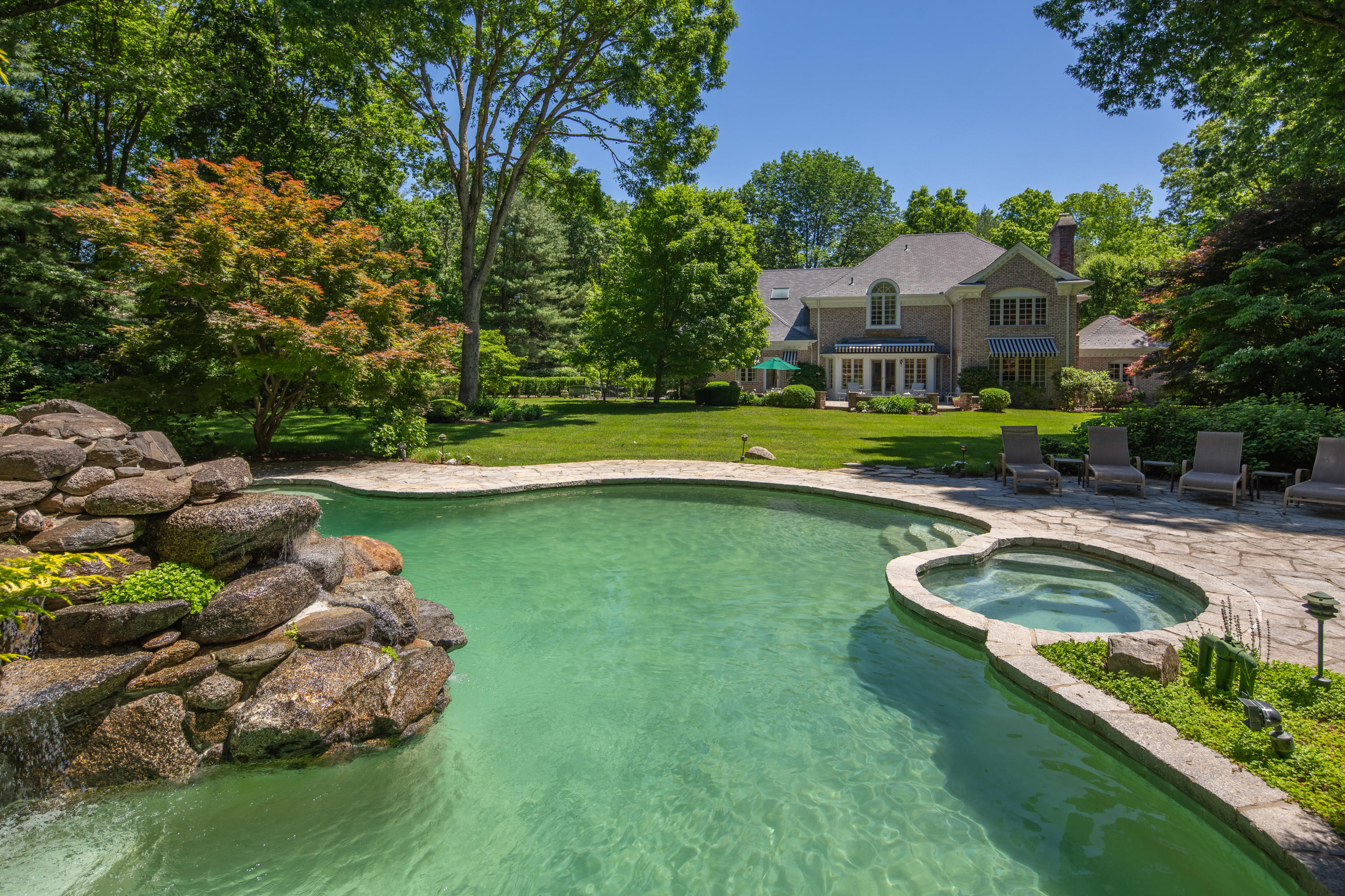 731 Hollow Tree Ridge Road Darien, CT 06820 - Photo 3 of 43 a front view of house with outdoor space and swimming pool