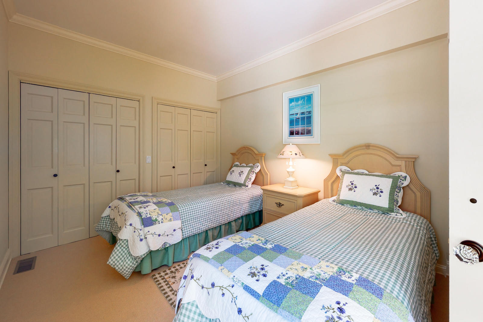 731 Hollow Tree Ridge Road Darien, CT 06820 - Photo 24 of 43 a bedroom with two beds and a lamp