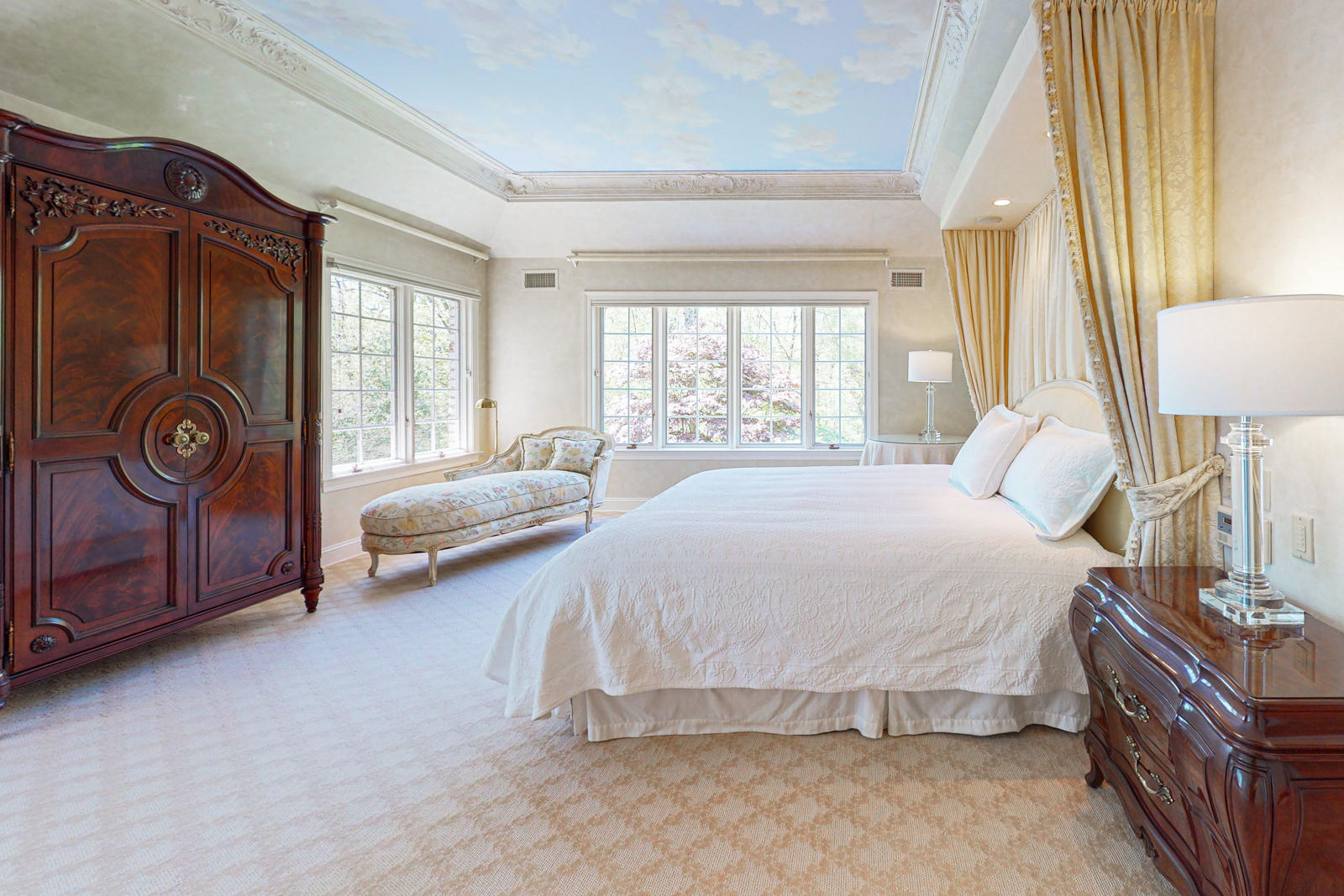 731 Hollow Tree Ridge Road Darien, CT 06820 - Photo 26 of 43 a spacious bedroom with a bed and dresser with mirror