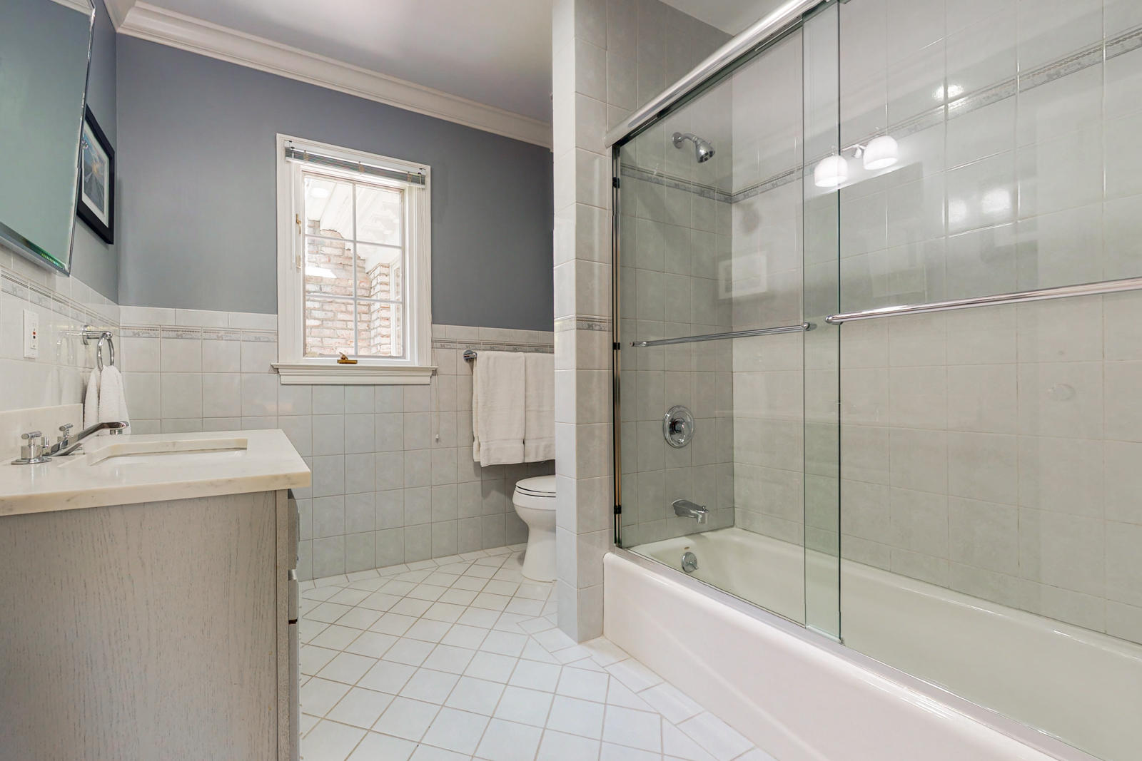 731 Hollow Tree Ridge Road Darien, CT 06820 - Photo 30 of 43 a bathroom with a granite countertop sink a toilet and bathtub