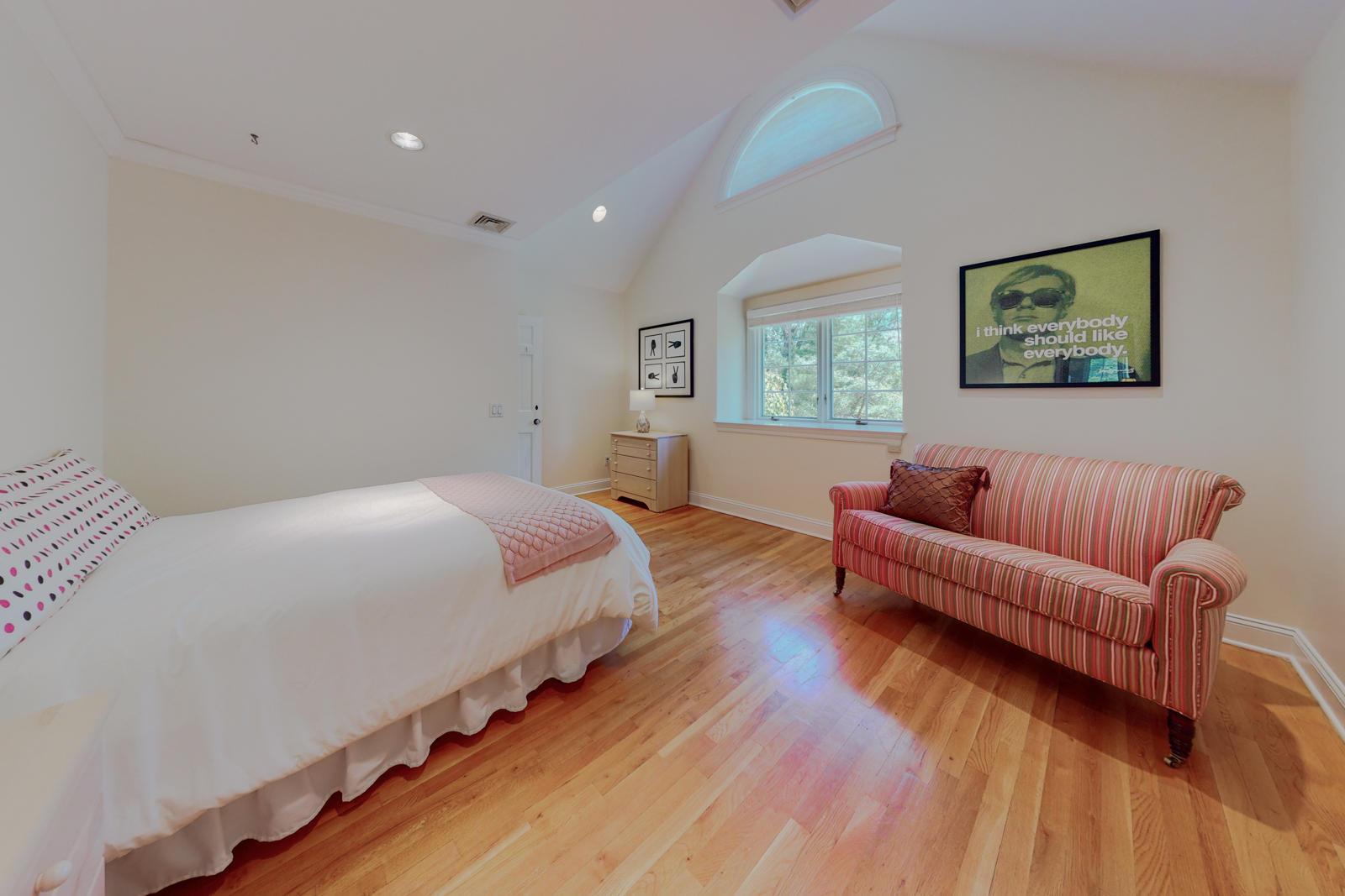 731 Hollow Tree Ridge Road Darien, CT 06820 - Photo 31 of 43 a spacious bedroom with bed and a couch