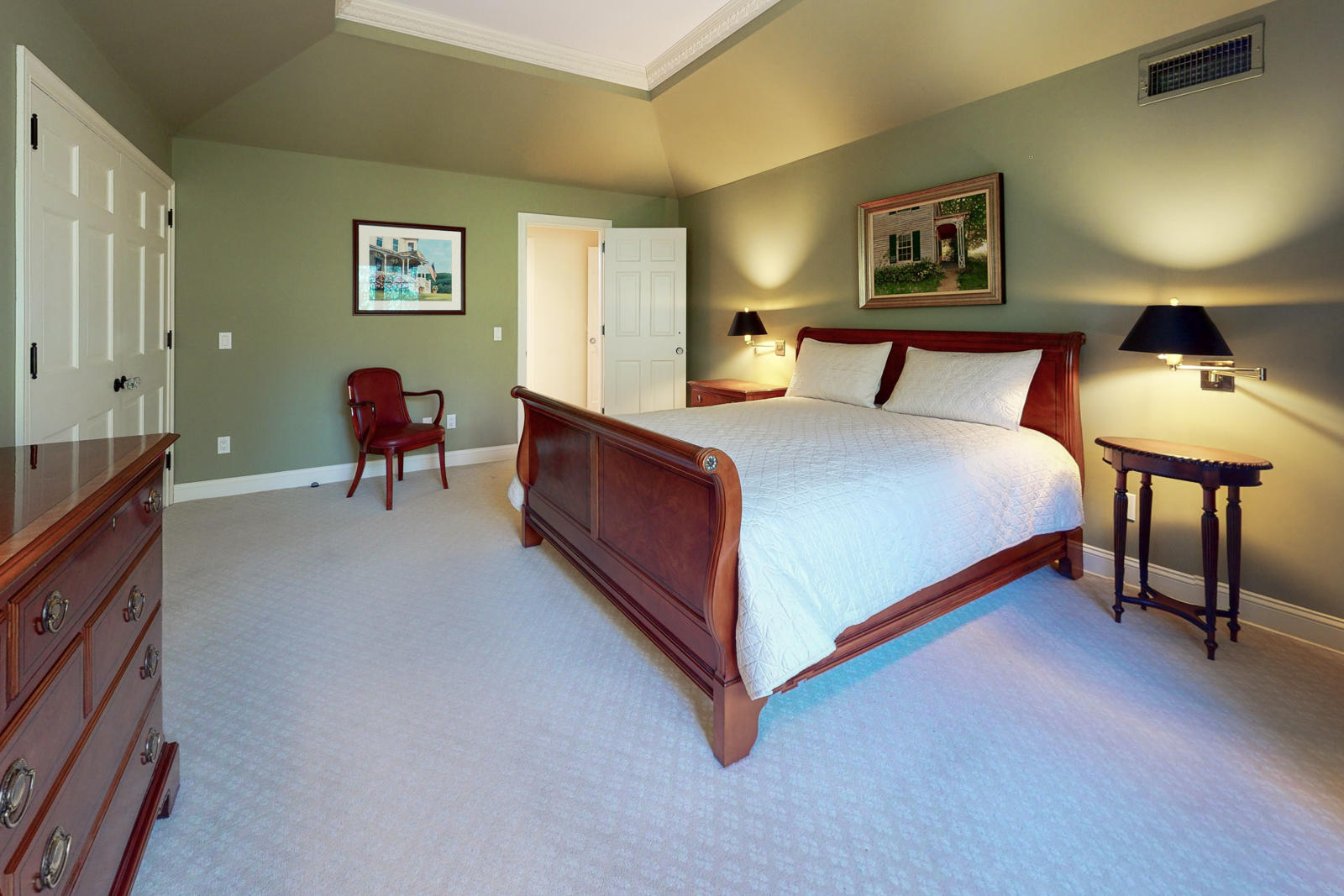 731 Hollow Tree Ridge Road Darien, CT 06820 - Photo 35 of 43 a bedroom with a bed and paintings on the wall