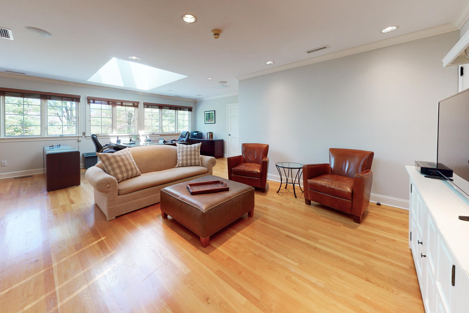 731 Hollow Tree Ridge Road Darien, CT 06820 - Photo 36 of 43 a living room with furniture and a flat screen tv
