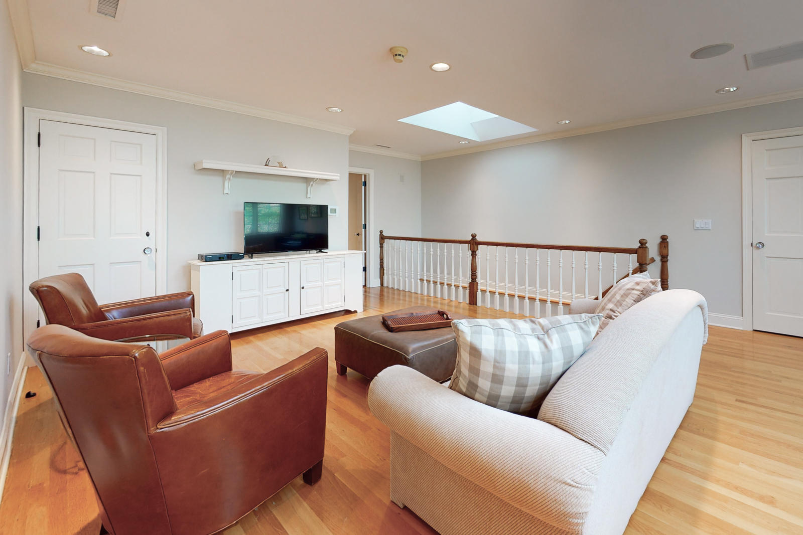 731 Hollow Tree Ridge Road Darien, CT 06820 - Photo 37 of 43 a living room with furniture and a flat screen tv