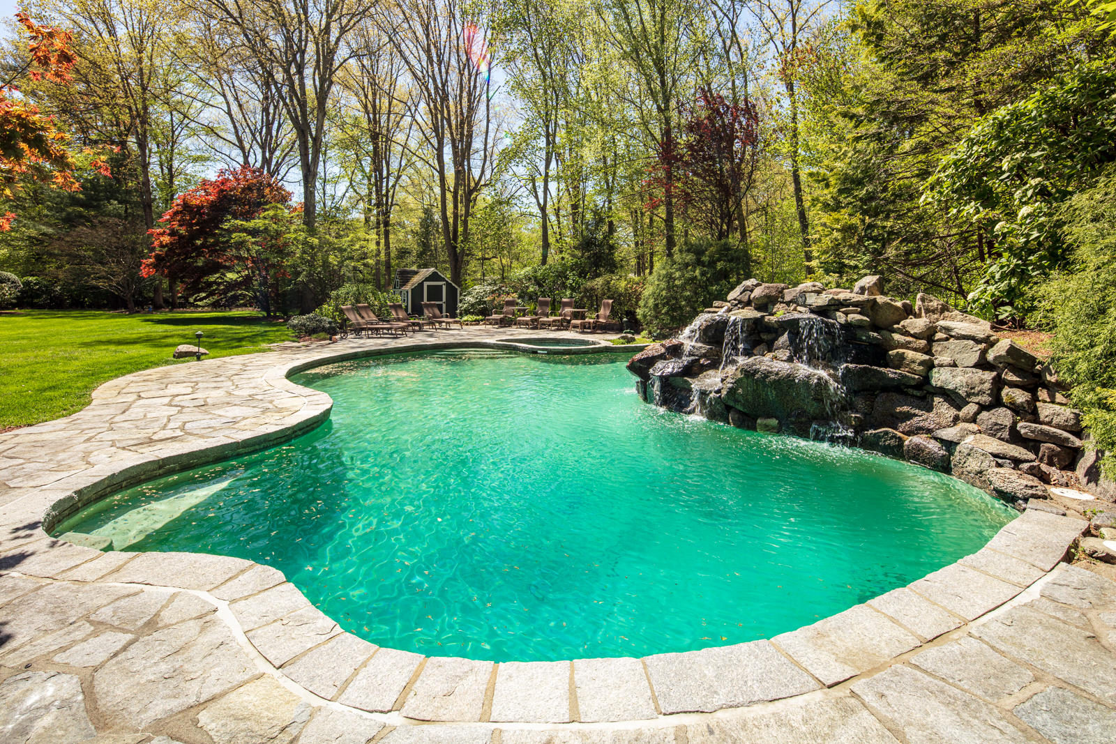 731 Hollow Tree Ridge Road Darien, CT 06820 - Photo 5 of 43 a view of a swimming pool with sitting area