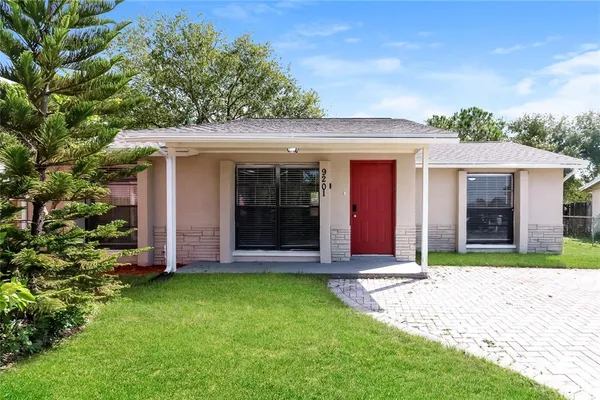 front view of a house with a yard
