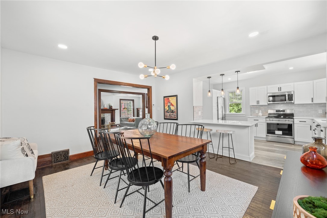 3139 Whitethorn Road Cleveland, OH 44118 - Photo 22 of 50 Dining area with light hardwood / wood-style flooring and a notable chandelier