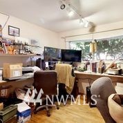 1240 Kenoyer Drive Bellingham, WA 98229 - Photo 12 of 22 a living room with furniture and a floor to ceiling window