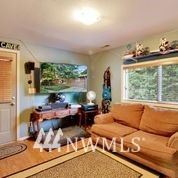 1240 Kenoyer Drive Bellingham, WA 98229 - Photo 13 of 22 a living room with furniture large window and floor to ceiling window