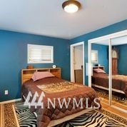 1240 Kenoyer Drive Bellingham, WA 98229 - Photo 14 of 22 a bedroom with a bed and window