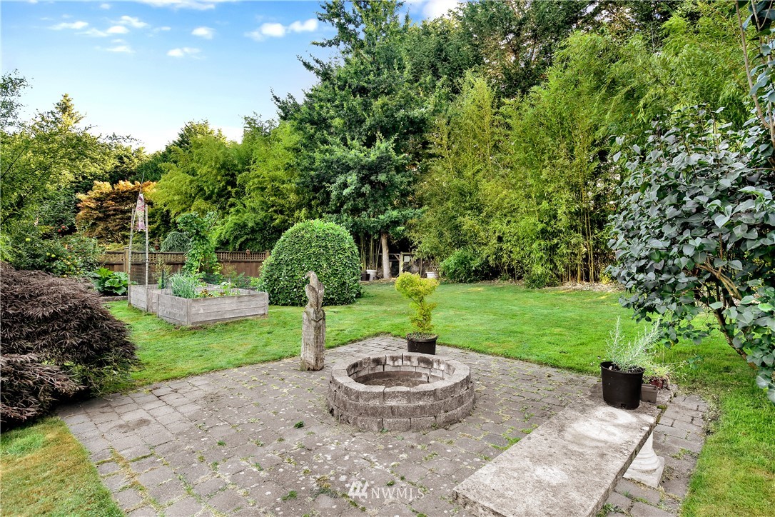 1240 Kenoyer Drive Bellingham, WA 98229 - Photo 18 of 22 a view of a garden with a fountain