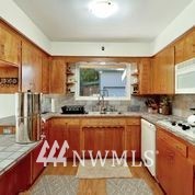 1240 Kenoyer Drive Bellingham, WA 98229 - Photo 4 of 22 a kitchen with a sink and cabinets