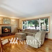 1240 Kenoyer Drive Bellingham, WA 98229 - Photo 5 of 22 a living room with furniture and a fireplace