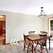 1240 Kenoyer Drive Bellingham, WA 98229 - Photo 7 of 22 a view of a dining room with furniture and chandelier