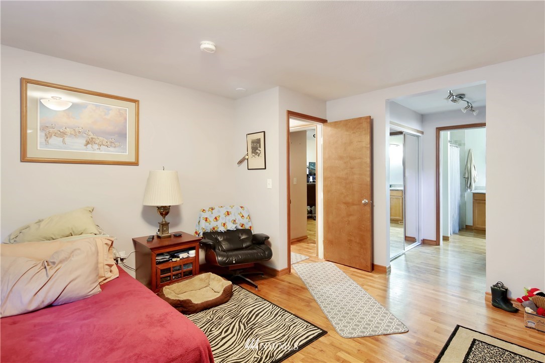 1240 Kenoyer Drive Bellingham, WA 98229 - Photo 8 of 22 a bedroom with furniture and a wooden floor
