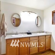 1240 Kenoyer Drive Bellingham, WA 98229 - Photo 10 of 22 a bathroom with a sink and a mirror