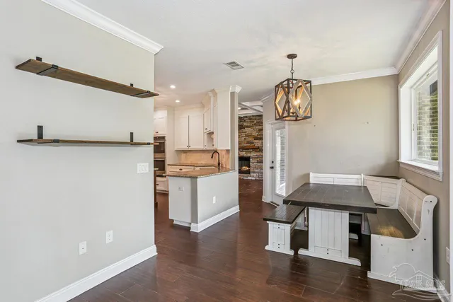 a view of room with window wooden floor and front door