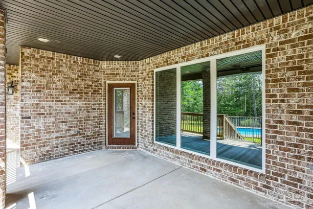 a aerial view of a house with swimming pool and garden view