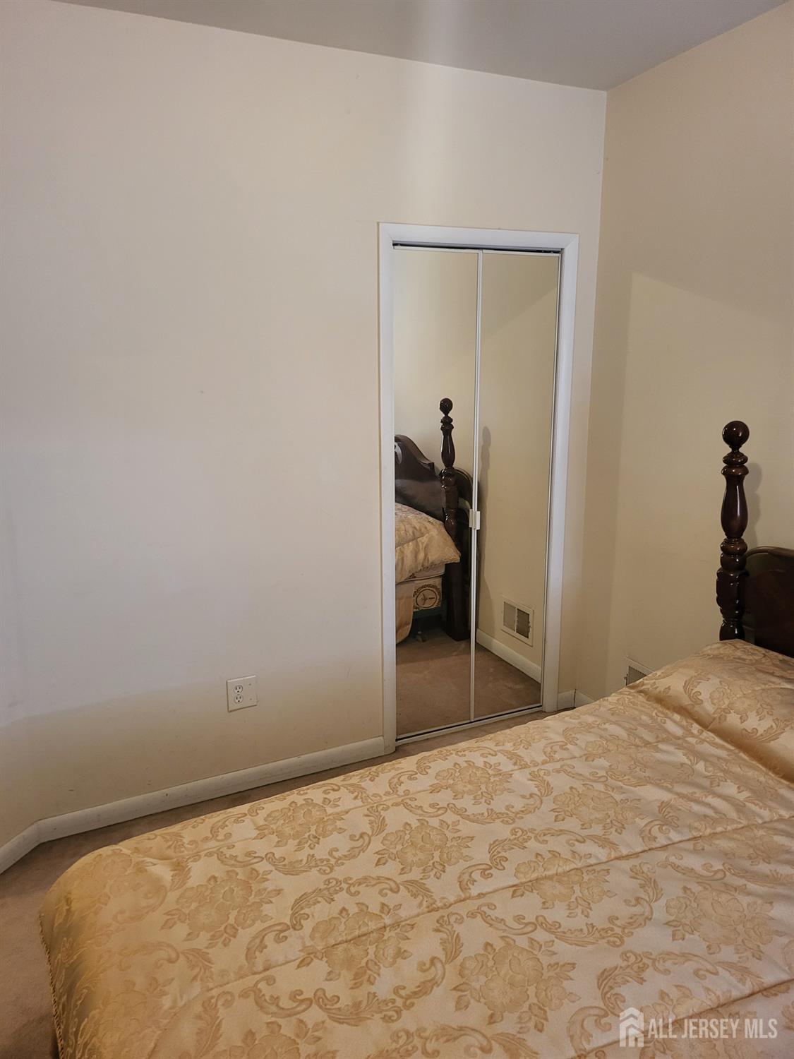 54 State Street Perth Amboy, NJ 08861 - Photo 13 of 35 a bedroom with a bed and a dresser