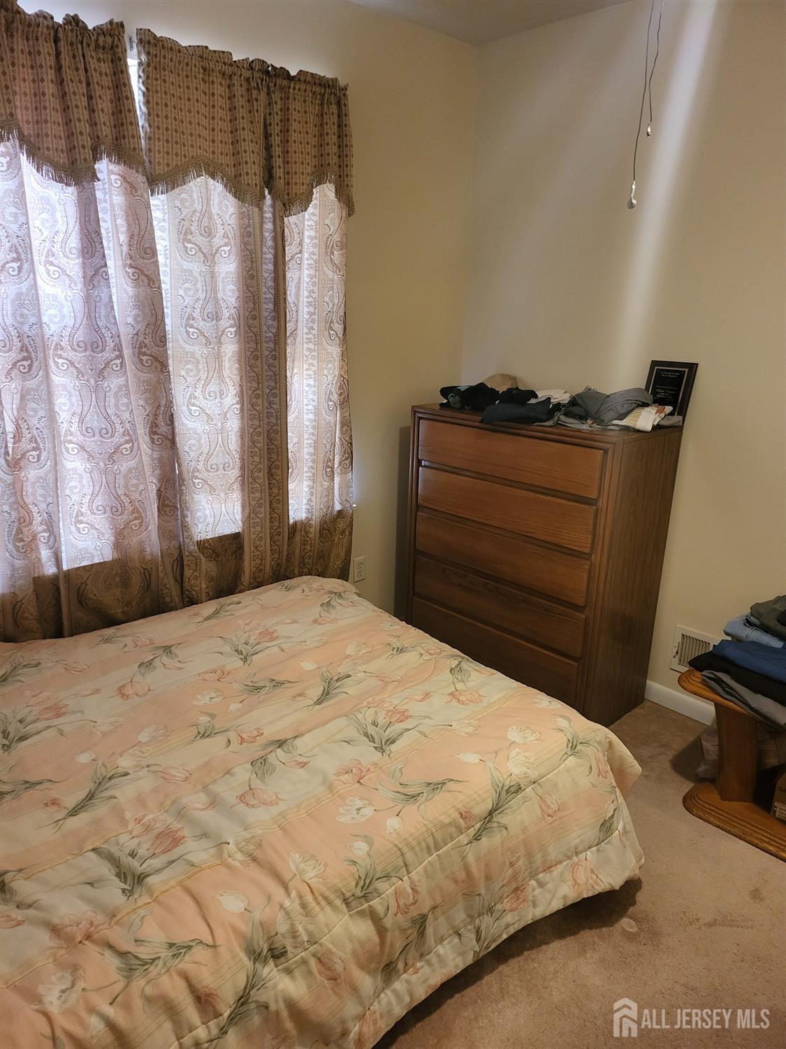 54 State Street Perth Amboy, NJ 08861 - Photo 15 of 35 a bedroom with a bed and a cabinets