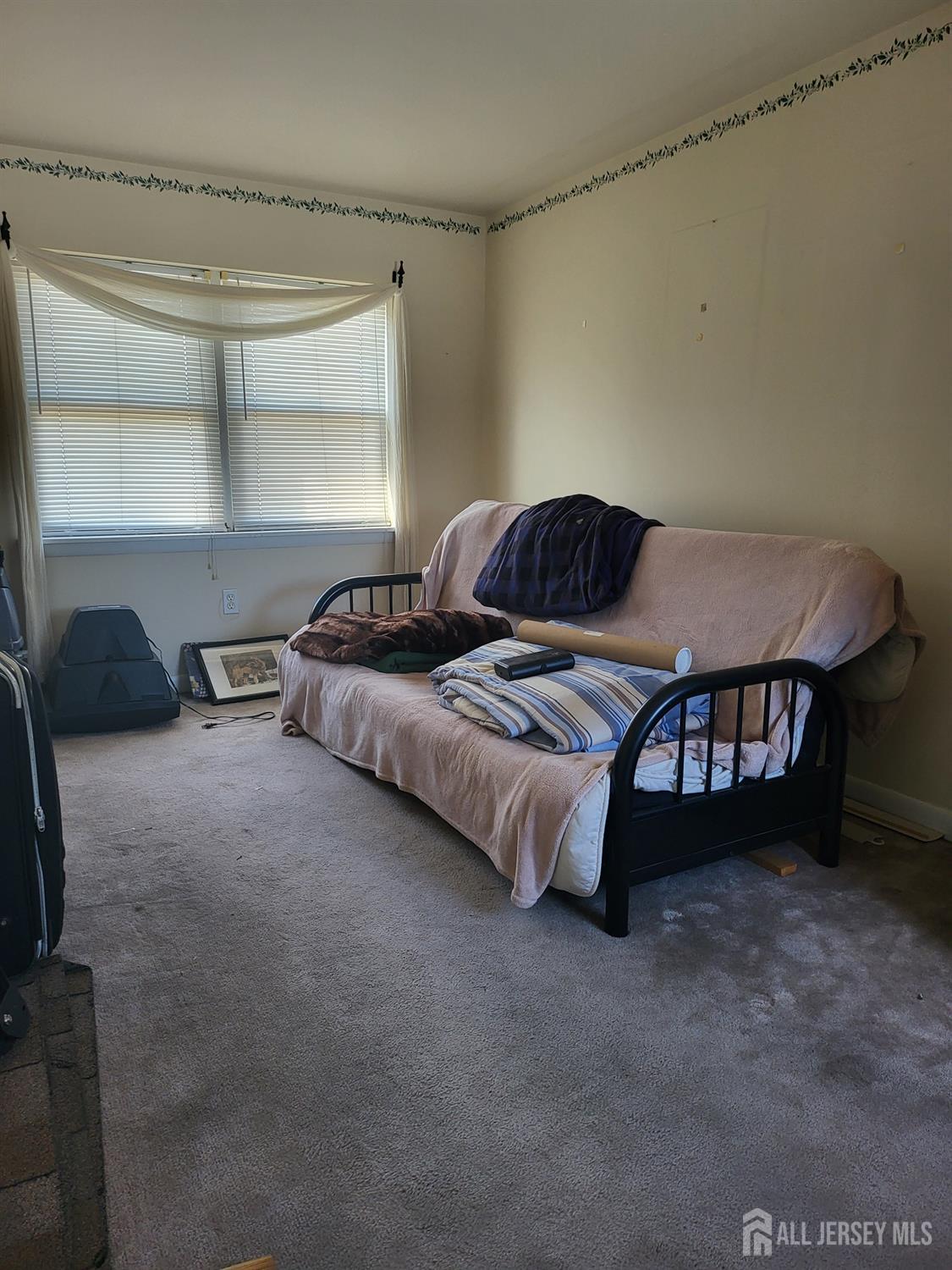 54 State Street Perth Amboy, NJ 08861 - Photo 18 of 35 a bedroom with a bed and a window