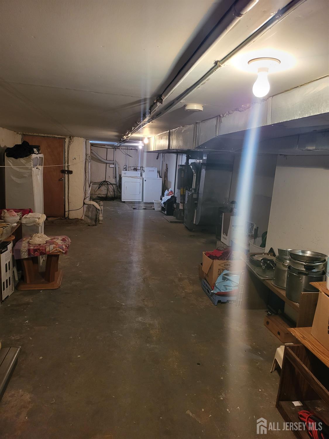 54 State Street Perth Amboy, NJ 08861 - Photo 19 of 35 a room with gym equipment and a large window