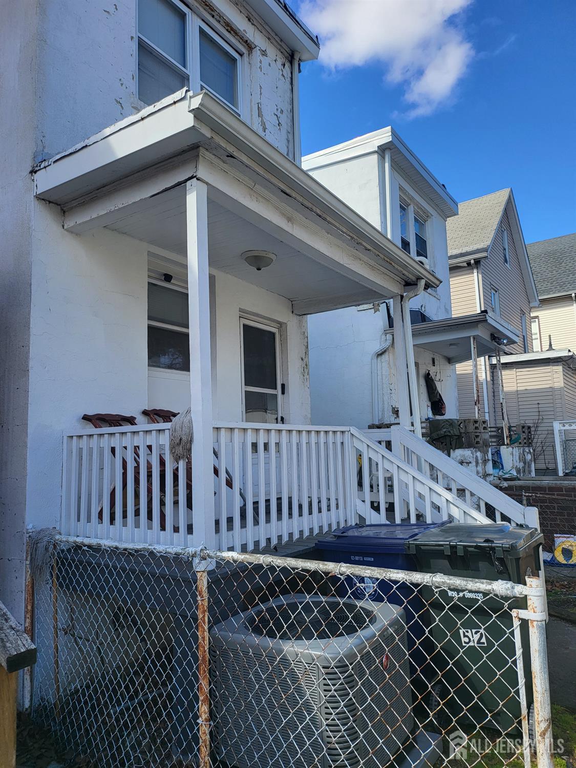 54 State Street Perth Amboy, NJ 08861 - Photo 23 of 35 a view of a house with a wooden deck