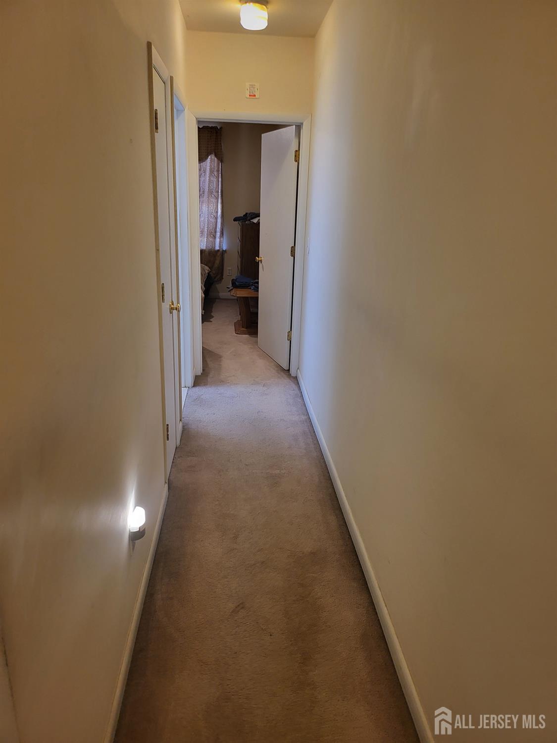 54 State Street Perth Amboy, NJ 08861 - Photo 8 of 35 a view of a hallway with a chair