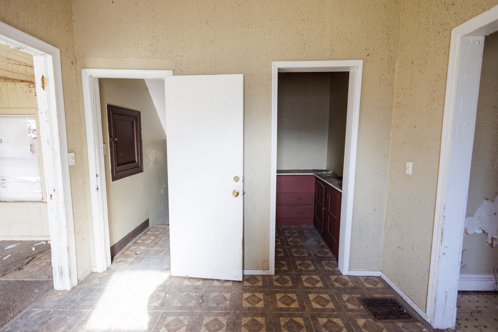 427 South Chicago Avenue Kankakee, IL 60901 - Photo 31 of 60 a view of a hallway with wooden floor and a living room