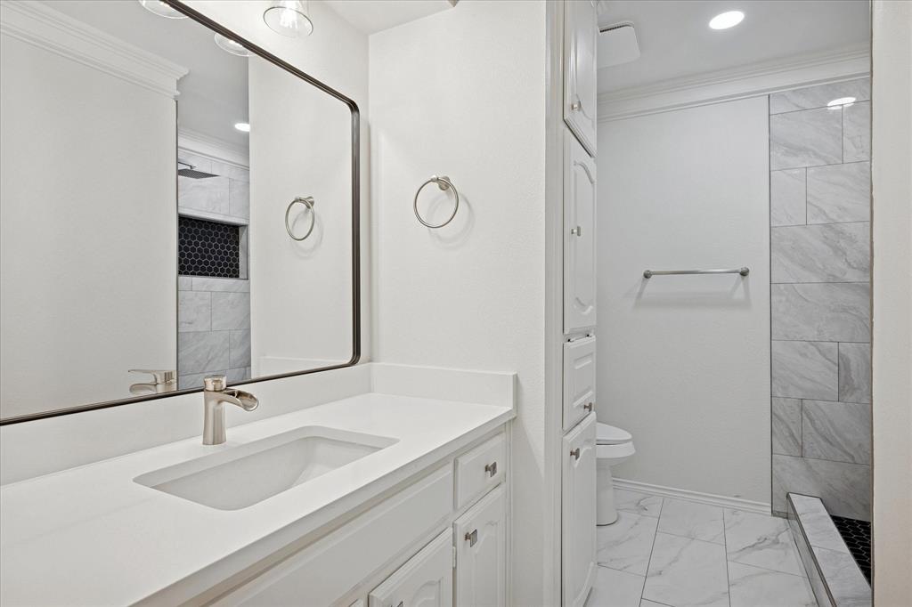 62 Legend Road Benbrook, TX 76132 - Photo 18 of 27 Updated first floor hall bathroom with oversized shower.