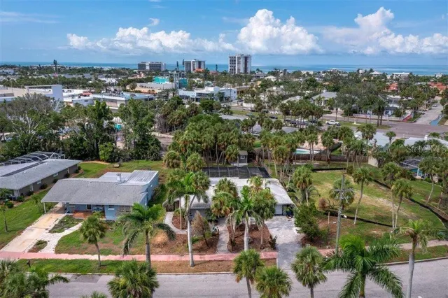 an aerial view of residential building and lake