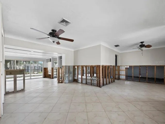 a view of a flesh screen room with furniture and floor to ceiling window