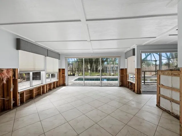 a view of a kitchen with a refrigerator and a ceiling fan
