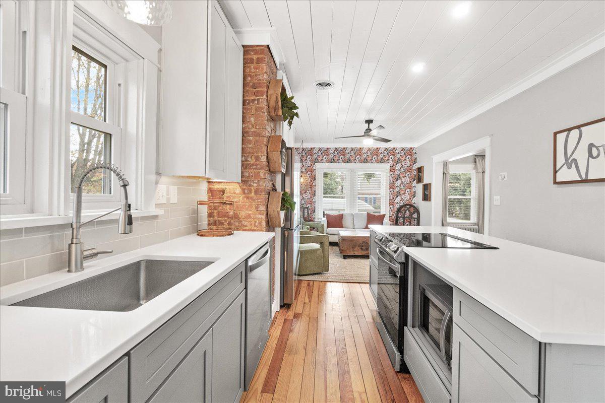 403 Wilson Place Frederick, MD 21702 - Photo 16 of 63 a kitchen with sink stove and refrigerator