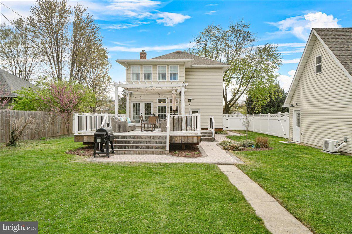 403 Wilson Place Frederick, MD 21702 - Photo 19 of 63 a view of a house with backyard and a bench