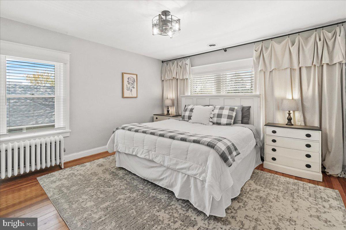 403 Wilson Place Frederick, MD 21702 - Photo 21 of 63 a bedroom with a bed and a window