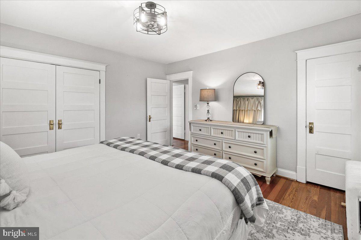 403 Wilson Place Frederick, MD 21702 - Photo 22 of 63 a bedroom with a bed and a dresser