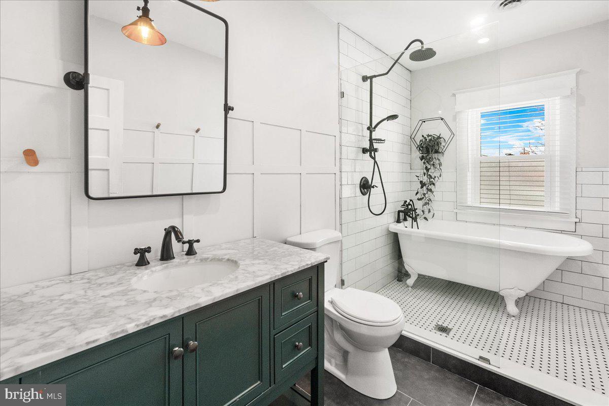 403 Wilson Place Frederick, MD 21702 - Photo 23 of 63 a bathroom with a sink a toilet and shower