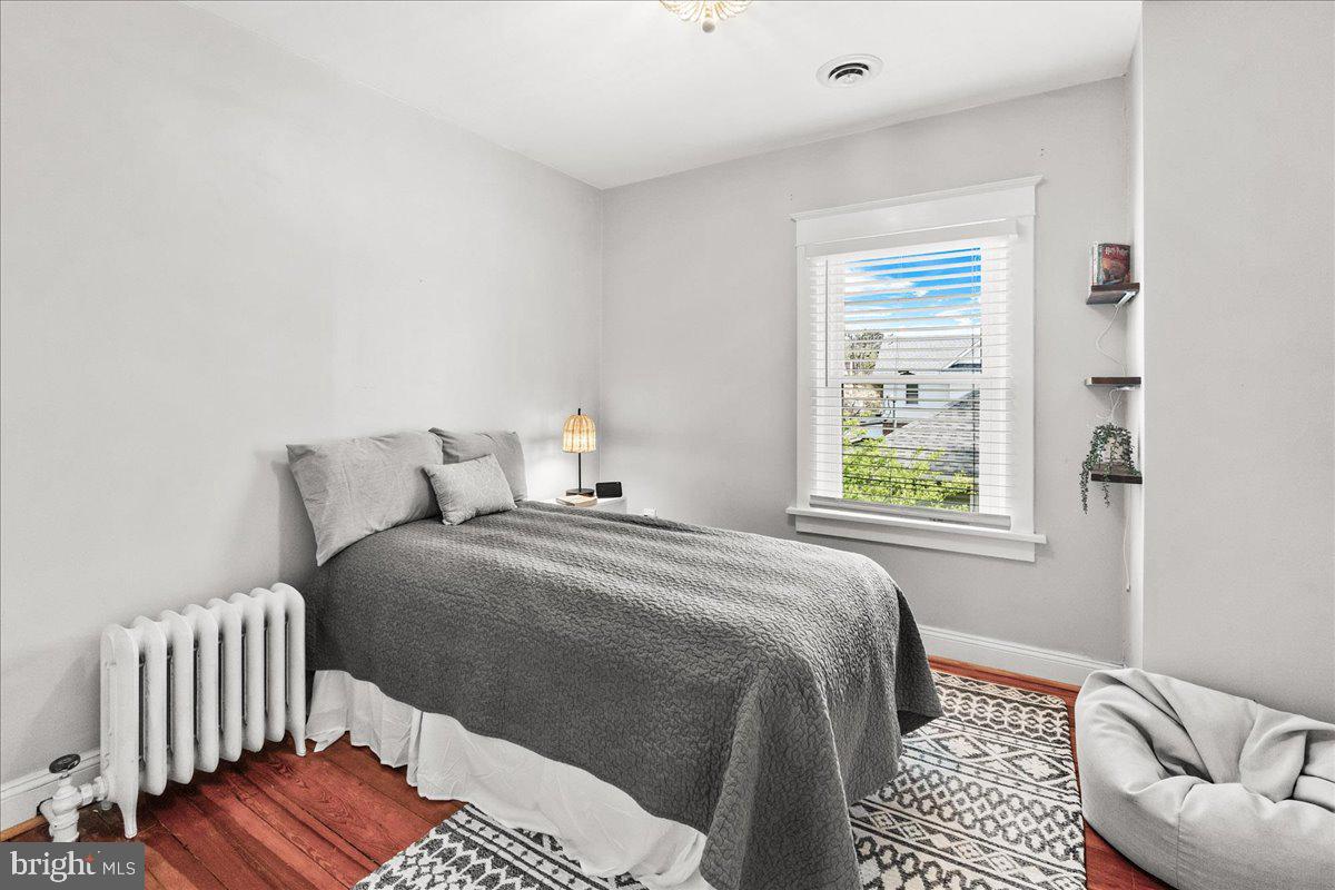 403 Wilson Place Frederick, MD 21702 - Photo 24 of 63 a bedroom with a bed and a couch